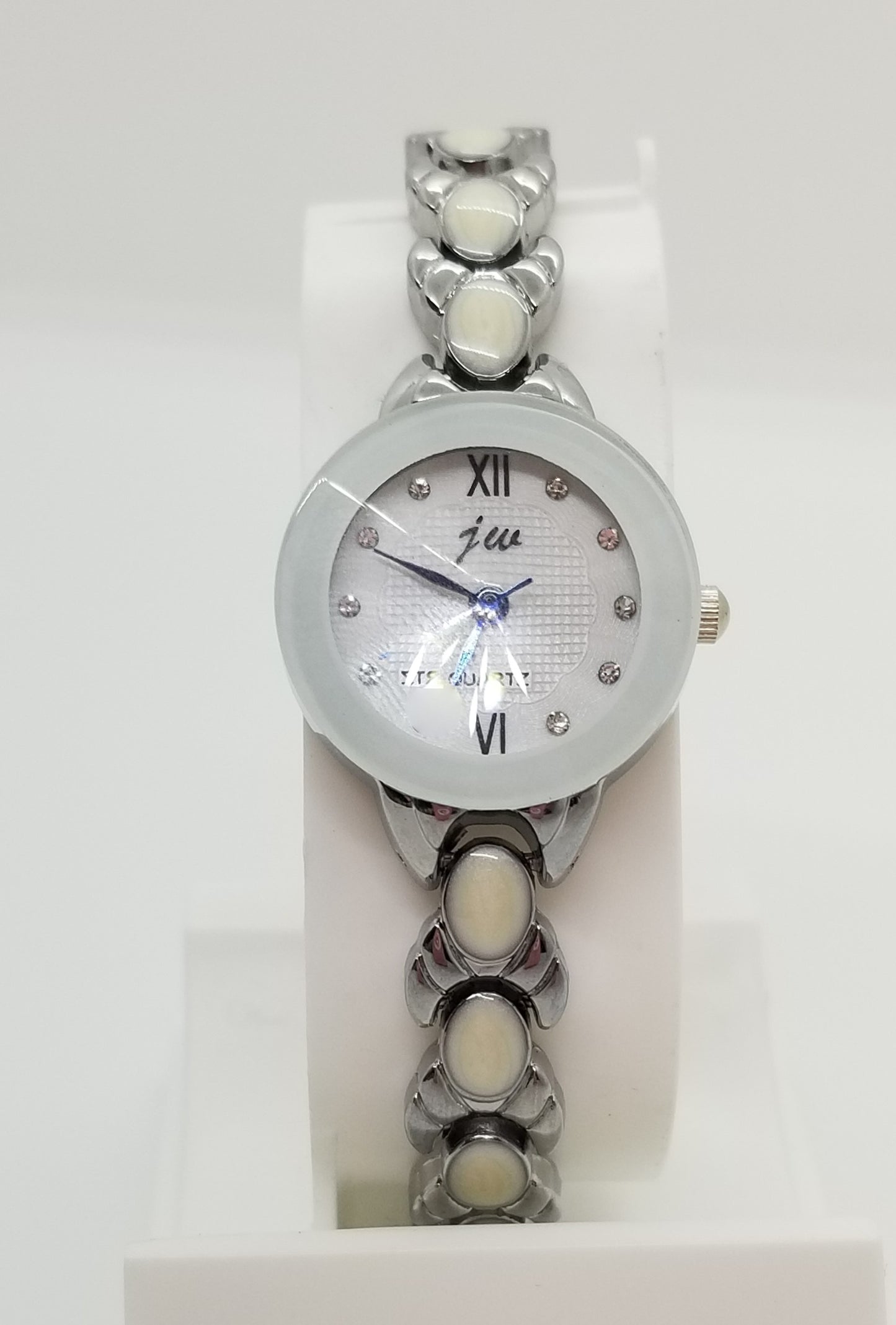 Silver base metal and white strap watch with rhinestones on watch face